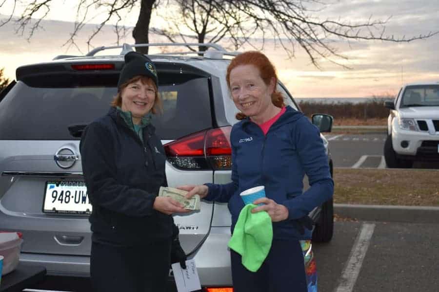 CT Hospice CEO & President receives money raised by the Milford Road Runners charity race.