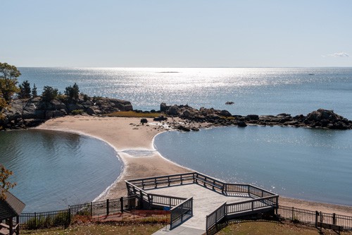 View of sun glimmering on the water from The Connecticut Hospice window