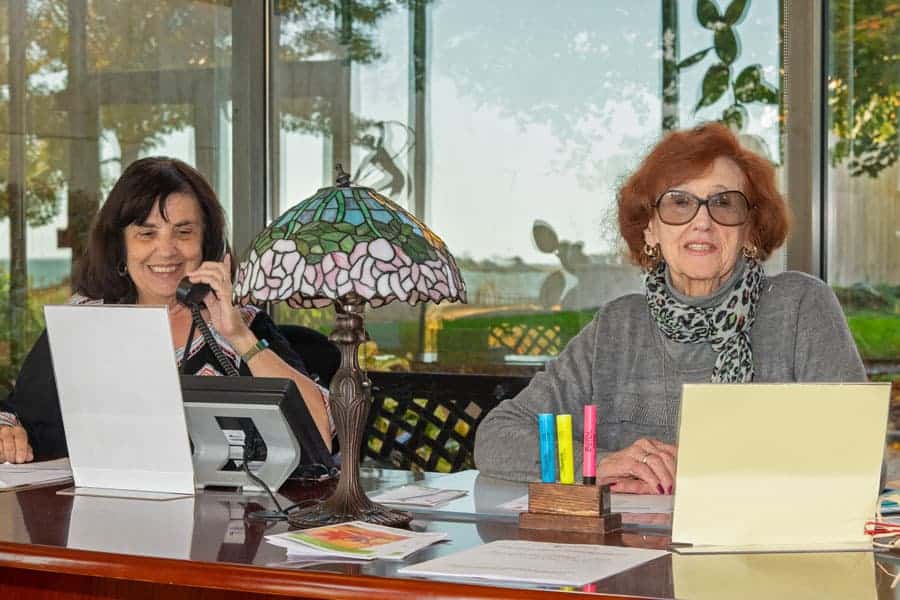 Volunteers workng at the front desk at the Connecticut Hospice