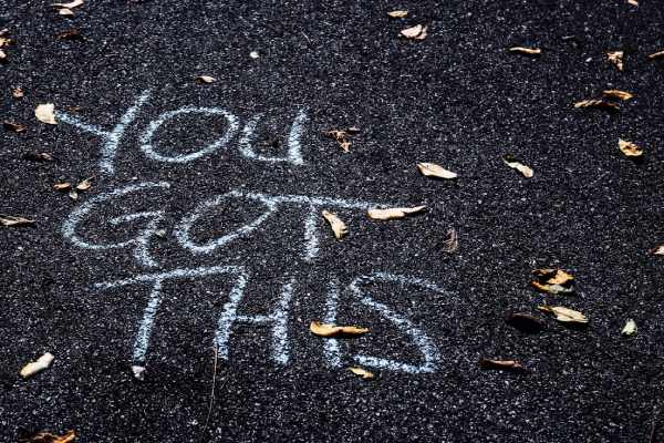 Writing on pavement in chalk that says, "You Got This".