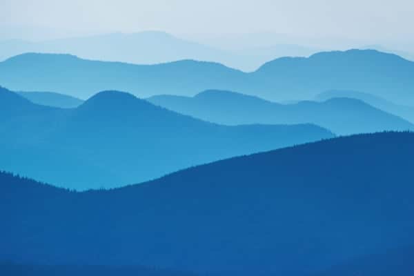 Range of blue hills fading in distance to horizon
