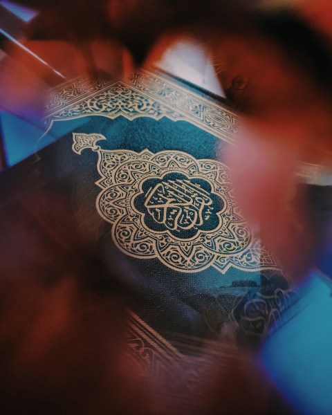 soft focus detail of ornate cover of Qur'an