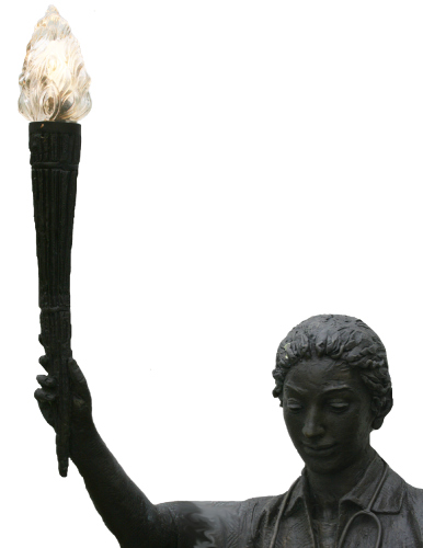 statue of nurse holding lit beacon