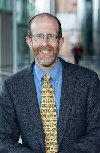 Pandemic expert Howard Forman in jacket and tie smiling