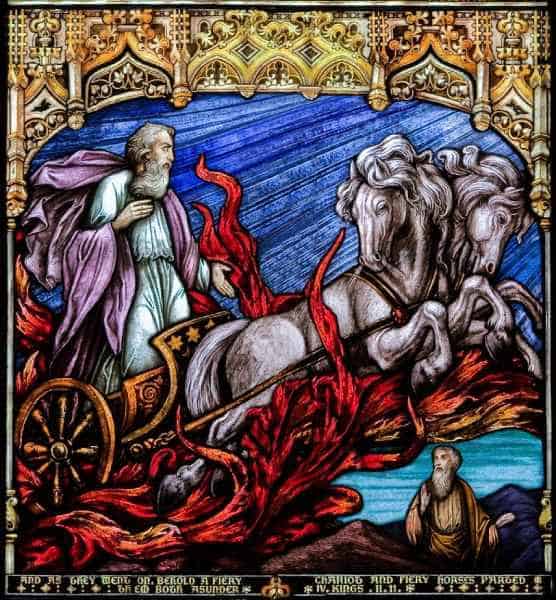 stained glass panel of Elijah riding a chariot pulled by two white horses