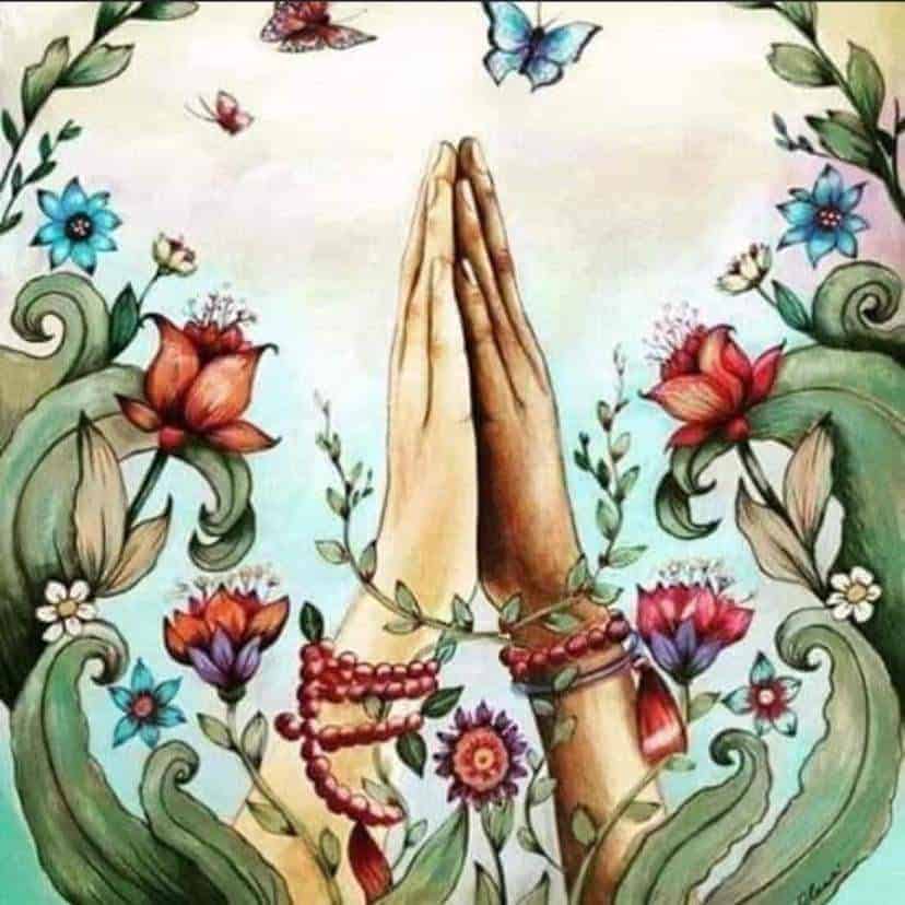Praying hands surrounded by growing vines of red flowers, blue flowers and luscious green leaves with blue butterfly and red butterfly at top of fingers