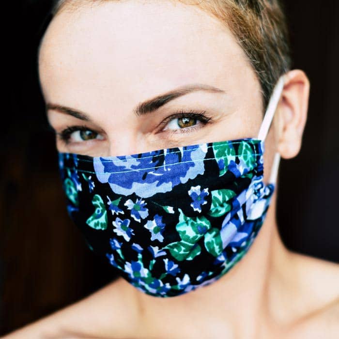 woman wearing floral print covid mask
