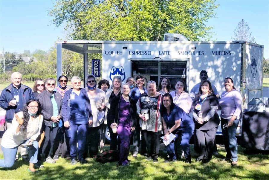 Connecticut Hospice Home Care staff hold outdoor meeting by coffee truck