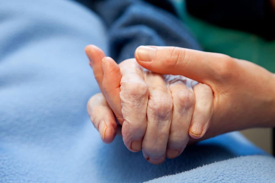 holding and elderly hand