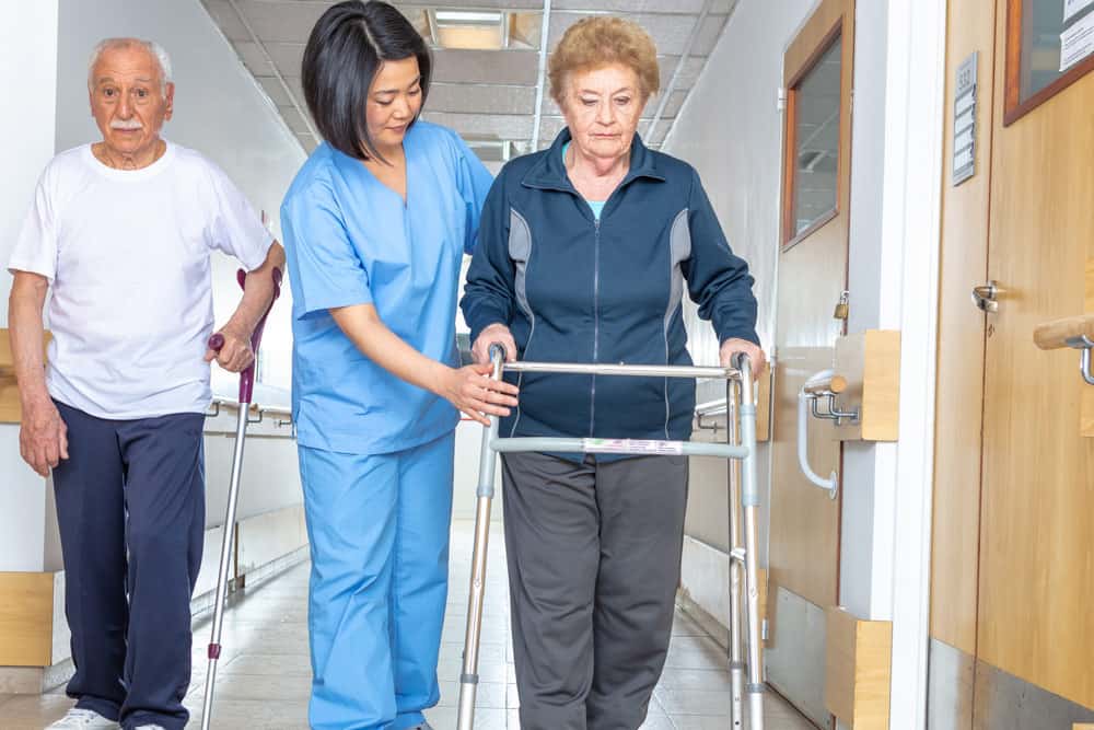 patients doing rehab with walker and cane