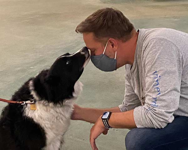 Pet therapy dog greets hospice family member
