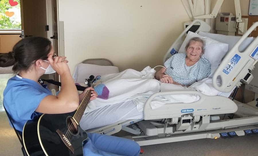 Connecticut hospice patient is visited by guitarist at bedside