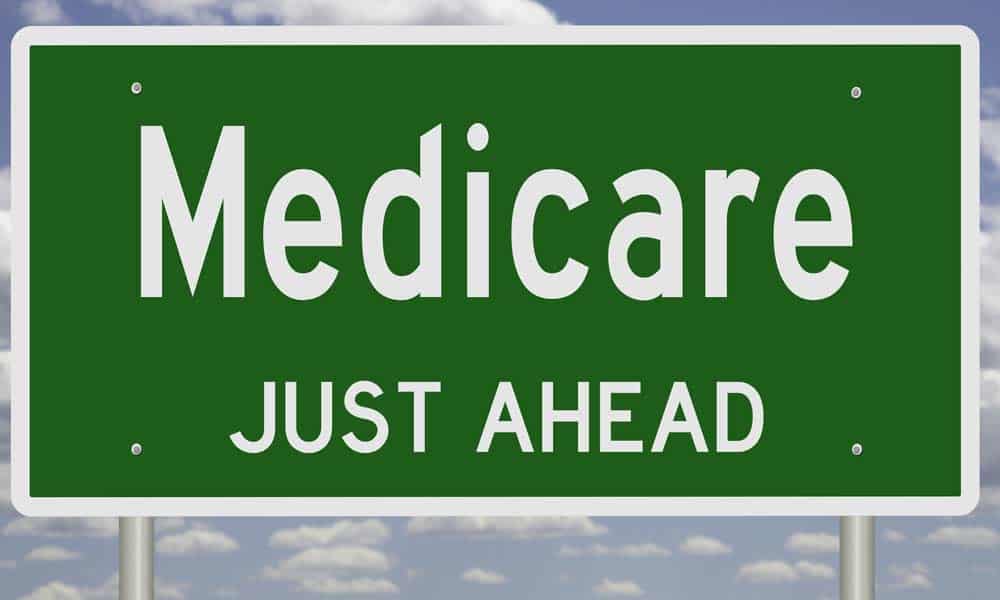 A street signs that says, "Medicare just ahead"