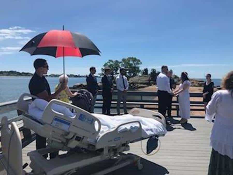 Wedding outside with patient watching