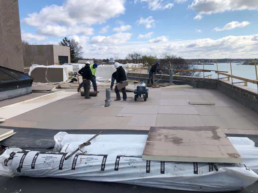 Workers repairing hospice roof