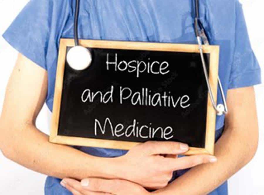 Hospice and Palliative on chalkboard held by doctor