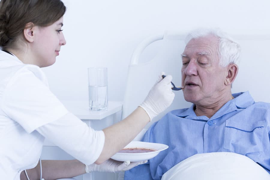 Hospice patient being fed