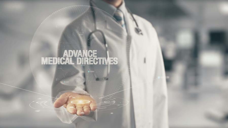 doctor with hand out holding the words Advanced Medical Directives