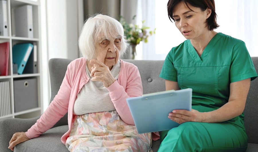 Nurse assessing alzheimer patient